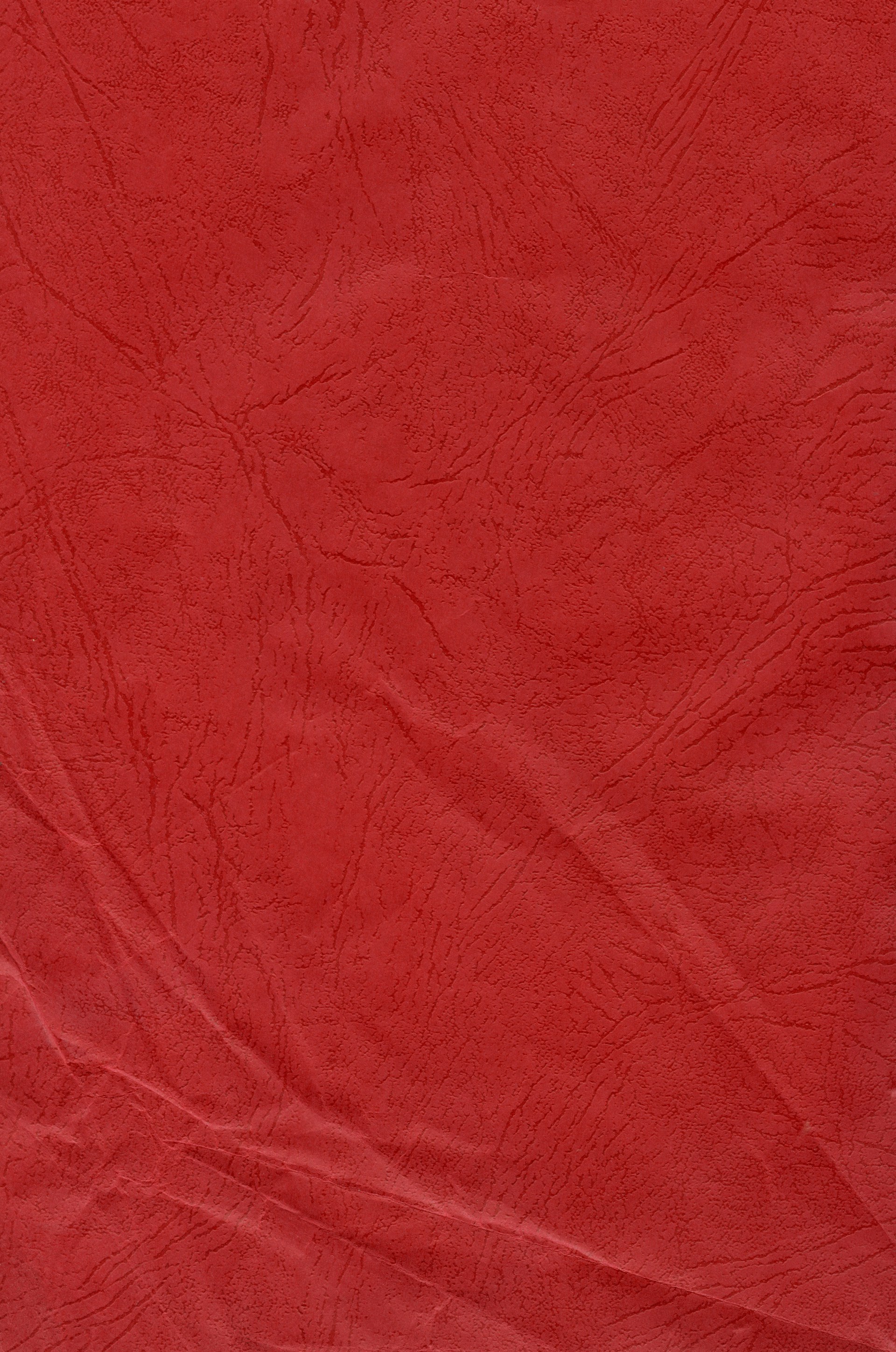 a close up of a red cloth textured