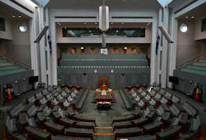 A lively political debate in a government chamber with passionate speakers