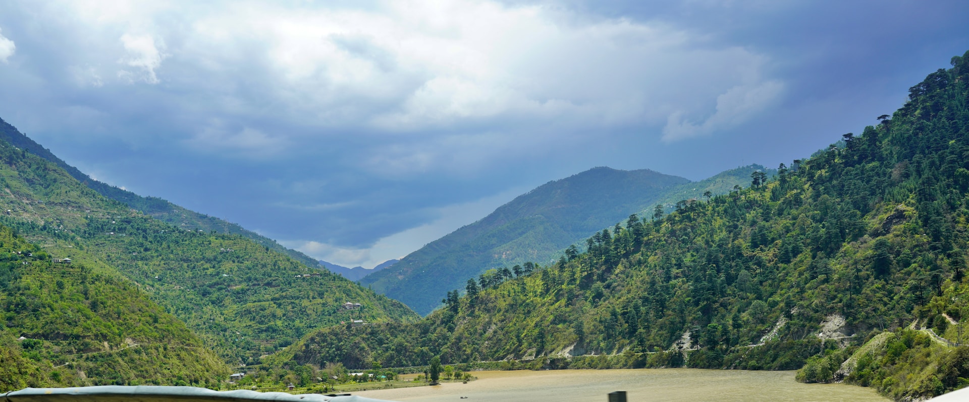 woman wearing yellow long-sleeved dress under white clouds and blue sky during daytime