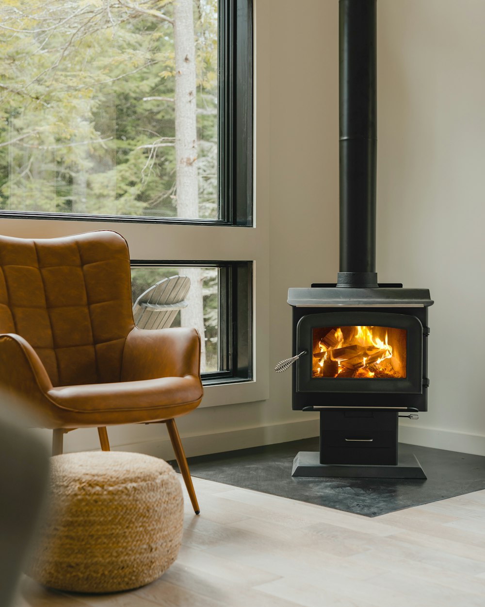 a living room with a chair and a fire place