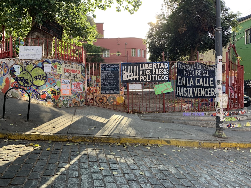 a bunch of signs on the side of a road