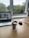 A professional workspace with a laptop and coffee cup.
