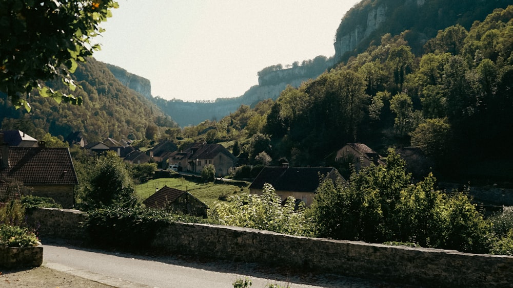 a scenic view of a village in the mountains