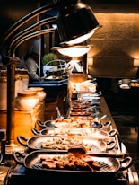 a buffet table with many plates of food on it