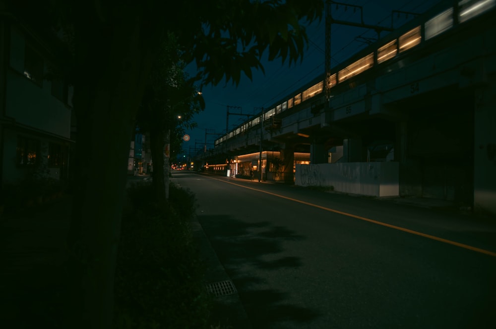 an empty street at night with lights on