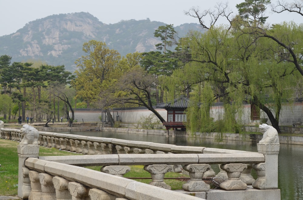 a stone bridge with a statue on top of it