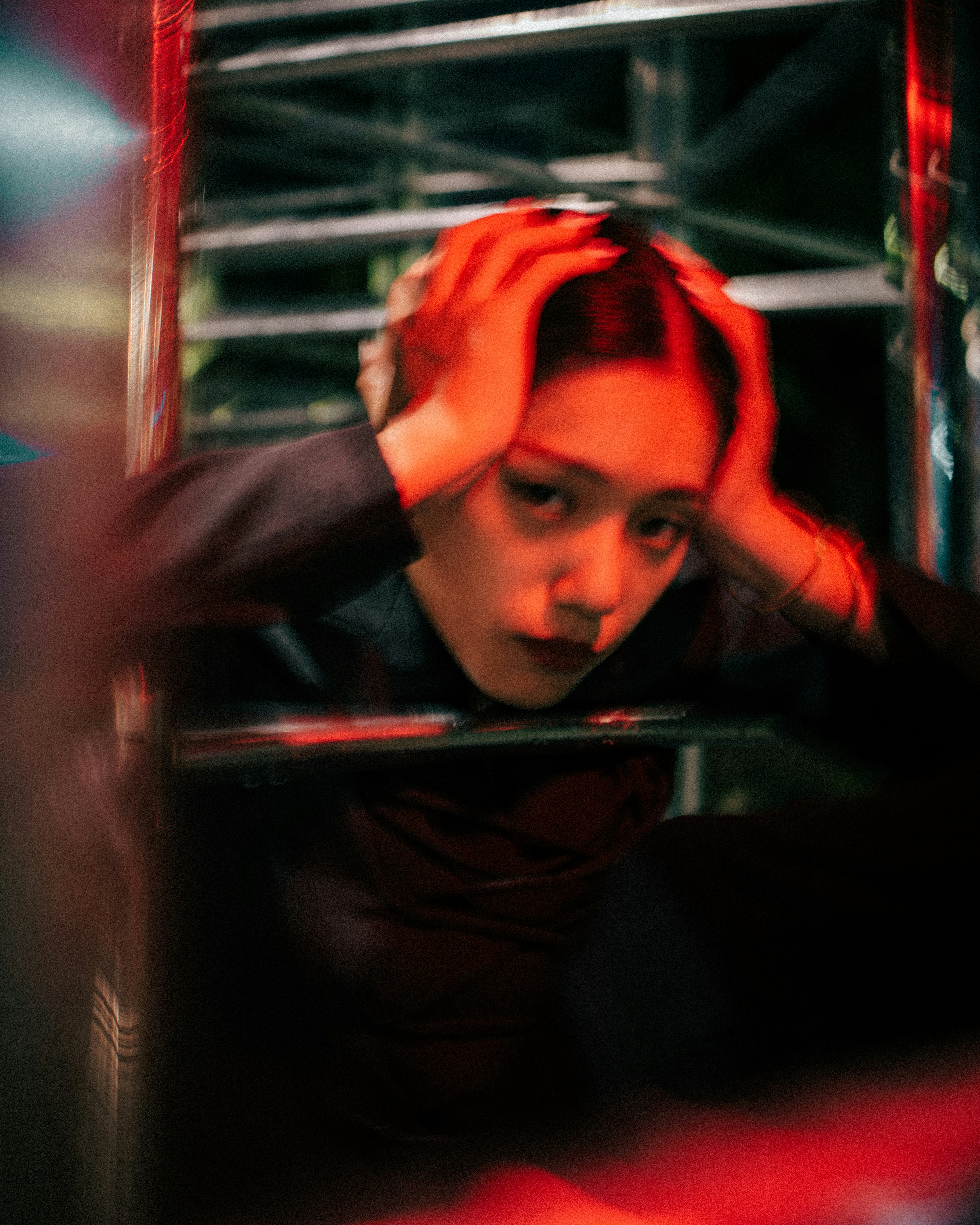 a woman is holding her head in her hands