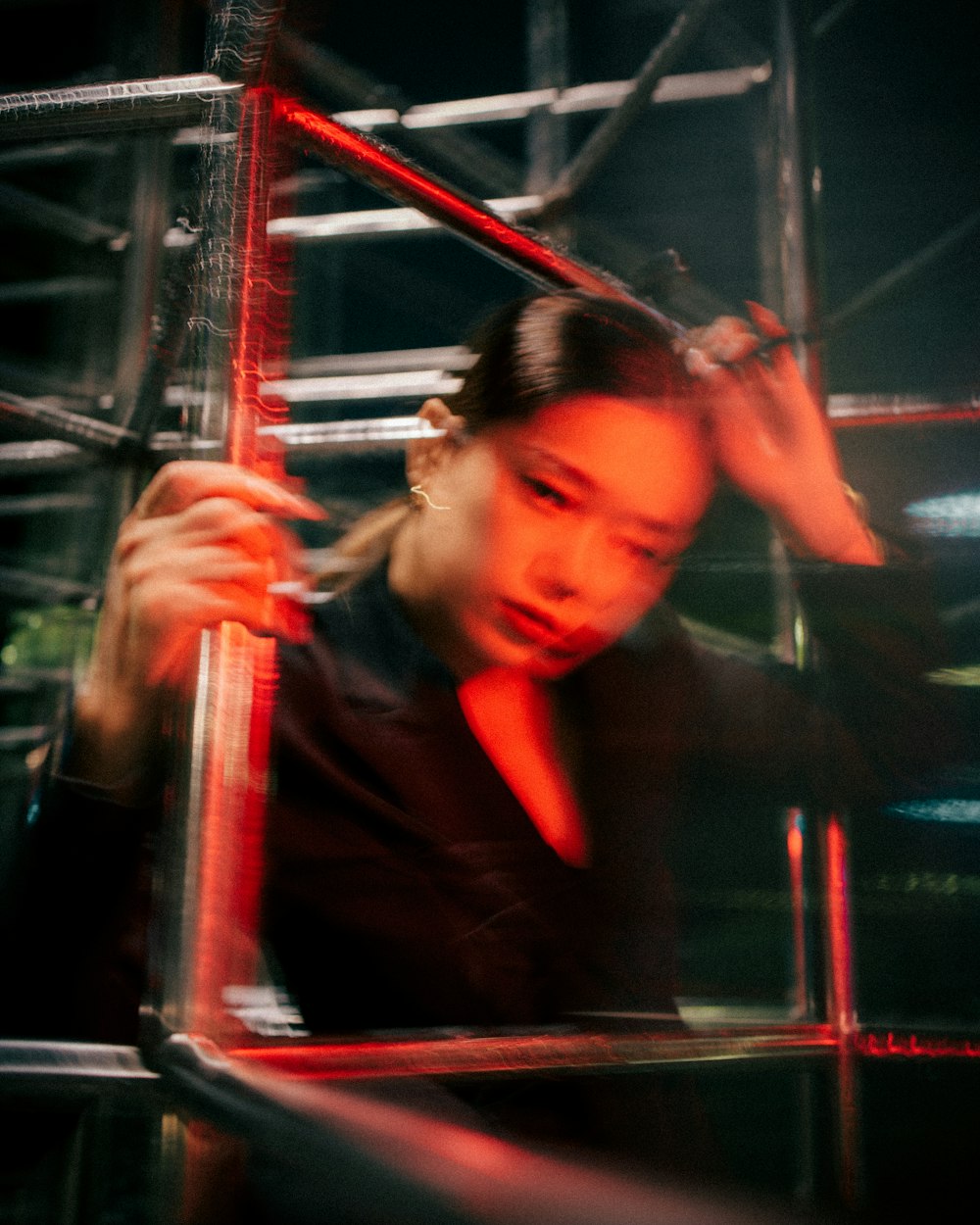 a woman in a black shirt and a red tie