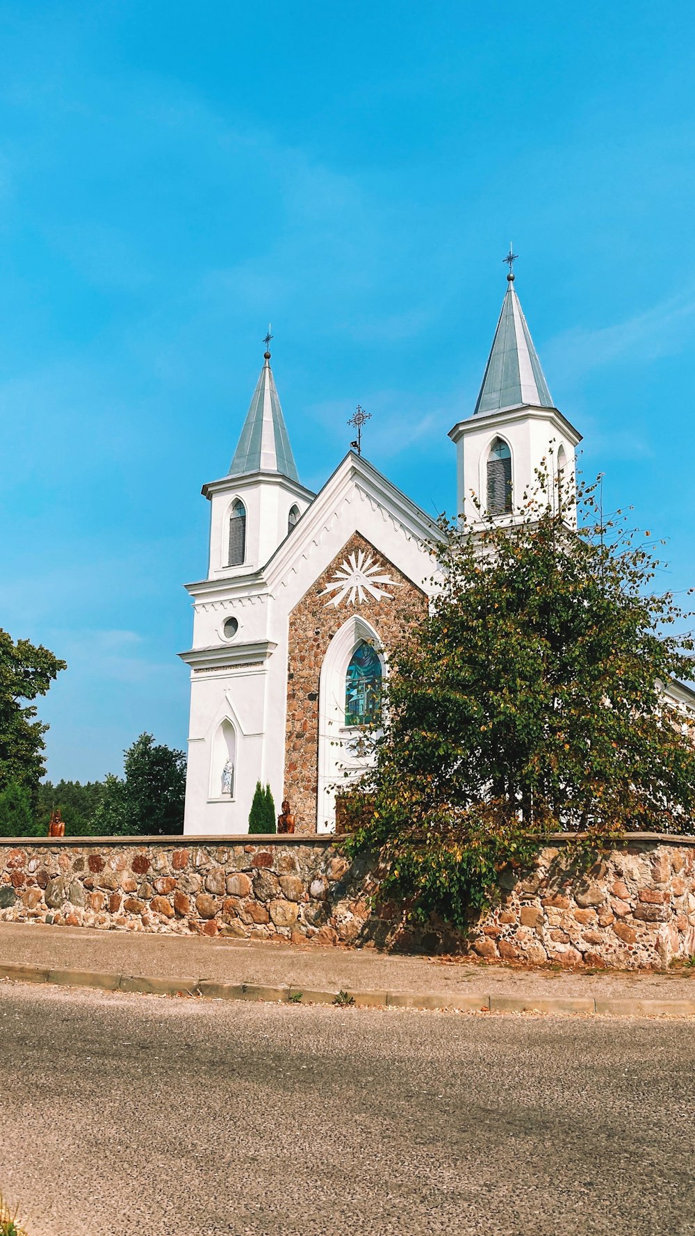 a large white church with two steeples on top of it