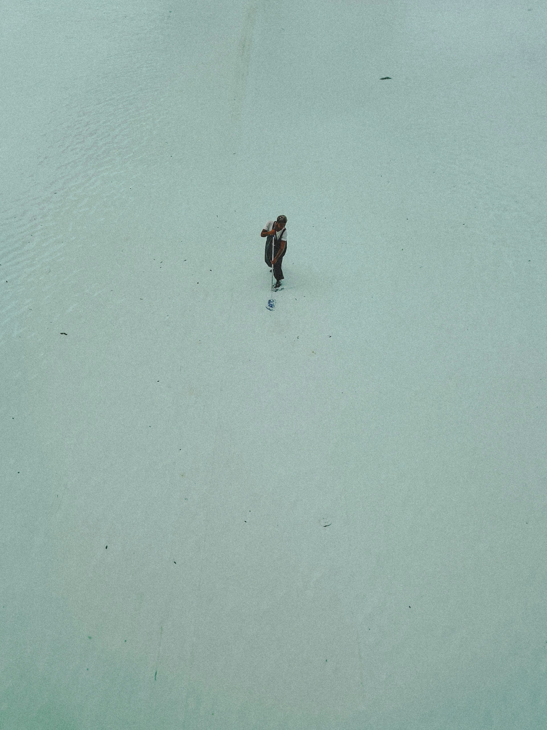 a person walking across a snow covered field