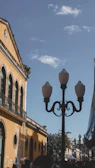 Traditional street scene in Puebla with cobblestone streets and vintage lampposts.