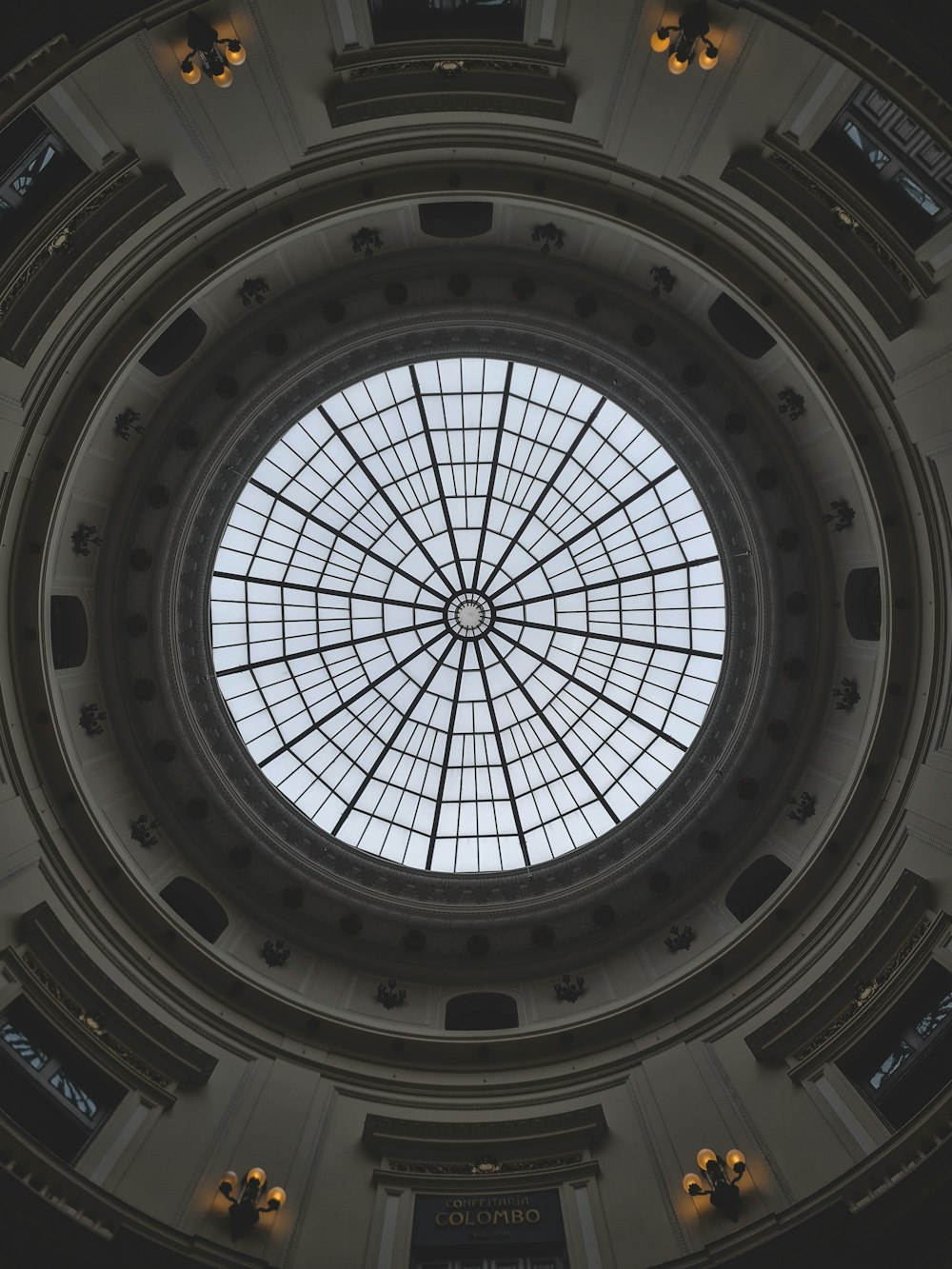 a circular glass ceiling in a building