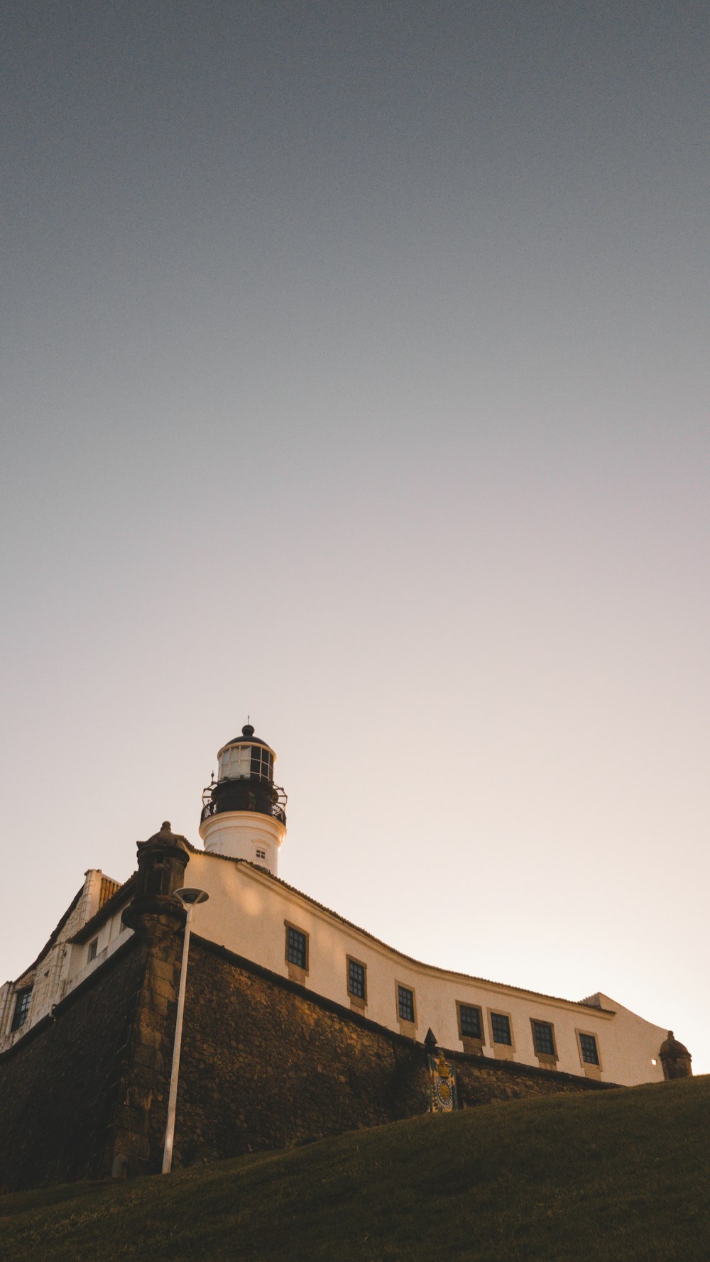 a light house on top of a hill