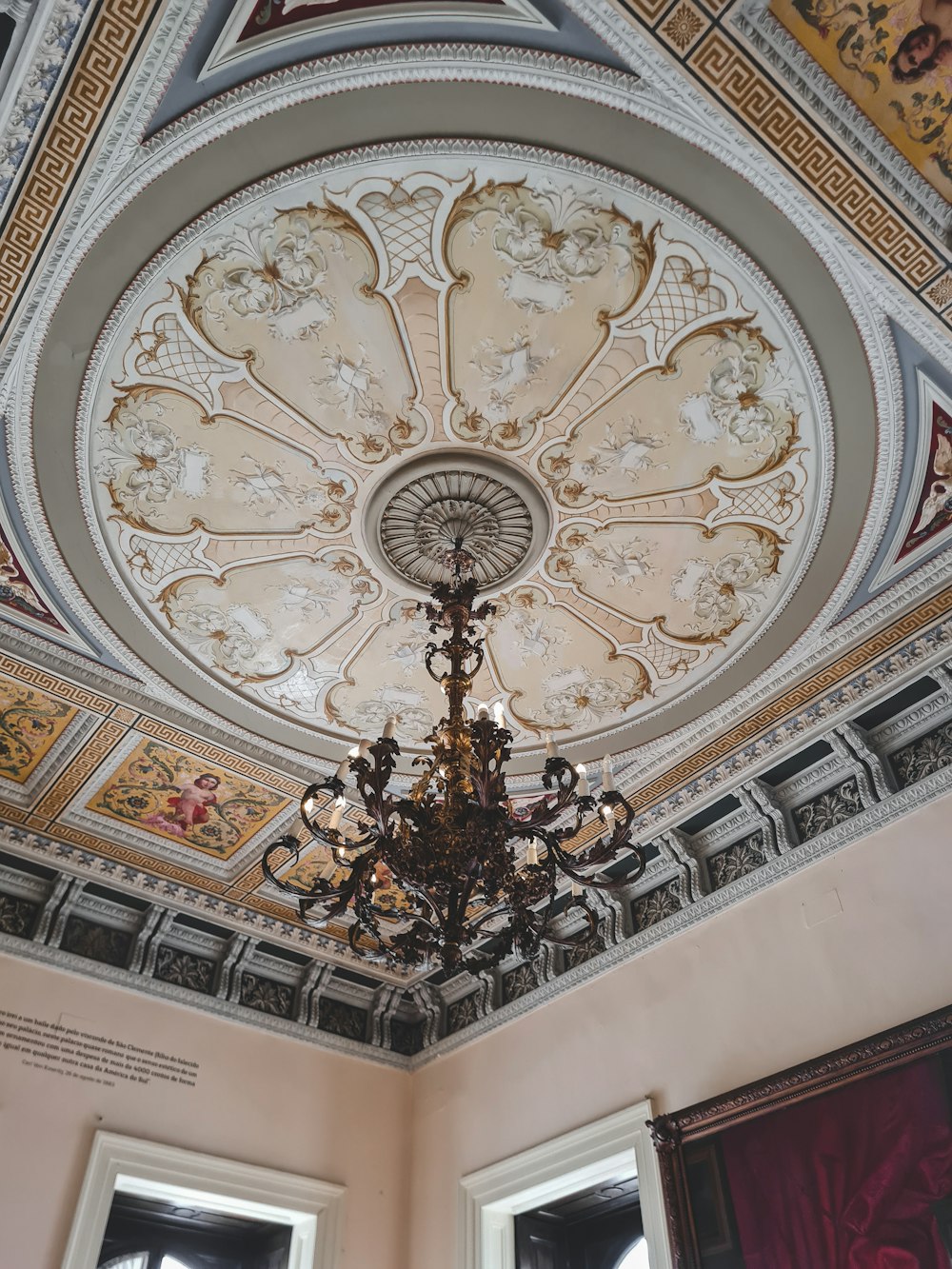 a chandelier hanging from the ceiling of a room