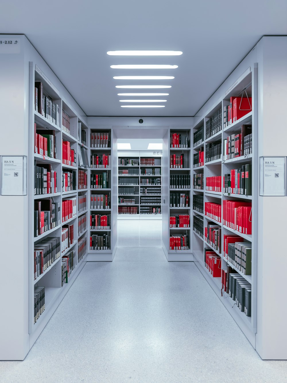 a room filled with lots of shelves filled with books