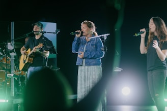 a group of people standing on top of a stage