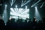 a group of people standing on top of a stage
