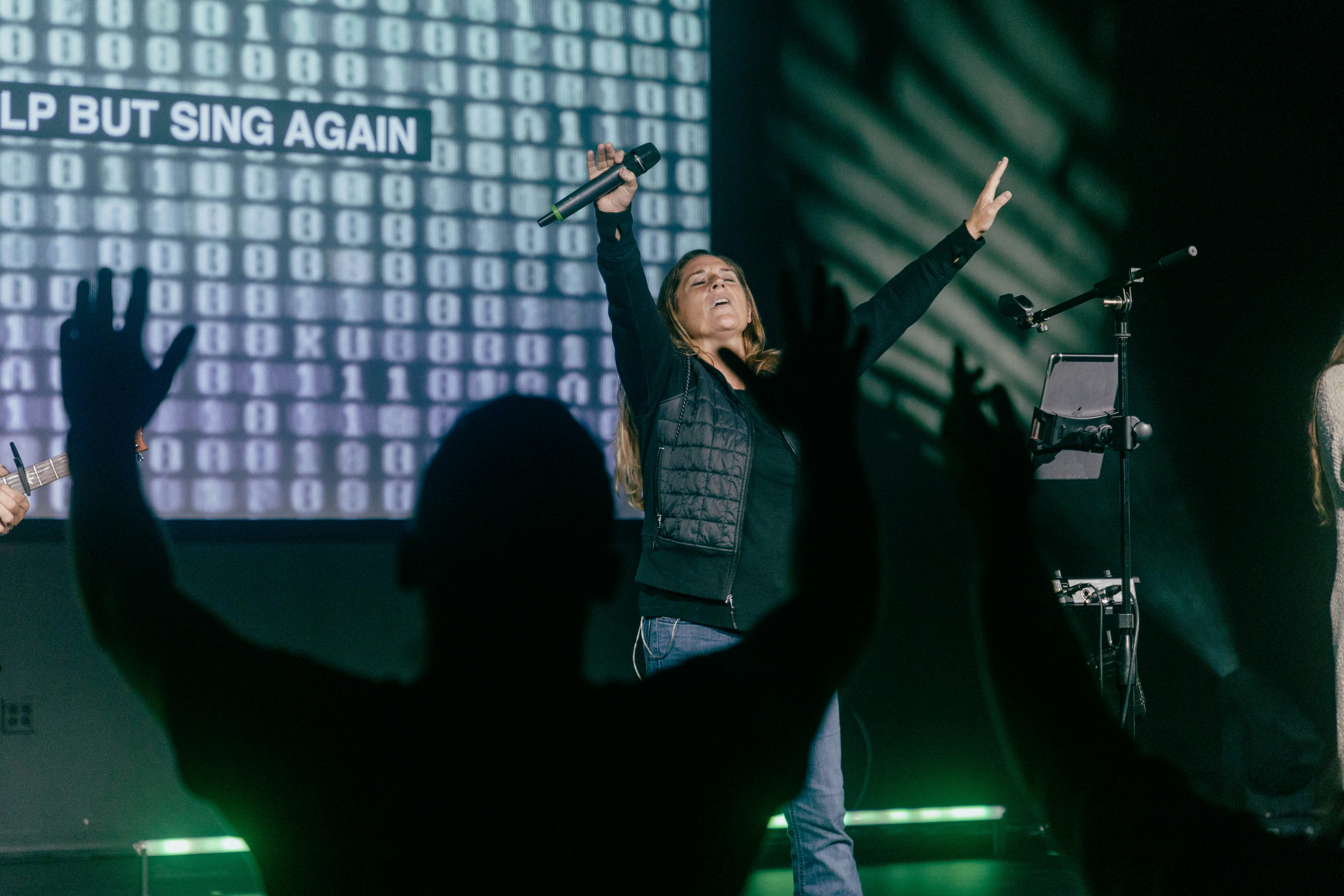 a group of people standing on top of a stage