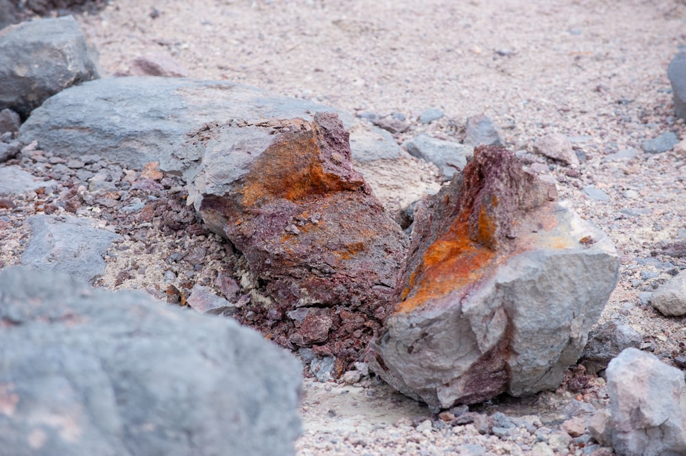 a close up of a rock on a dirt ground