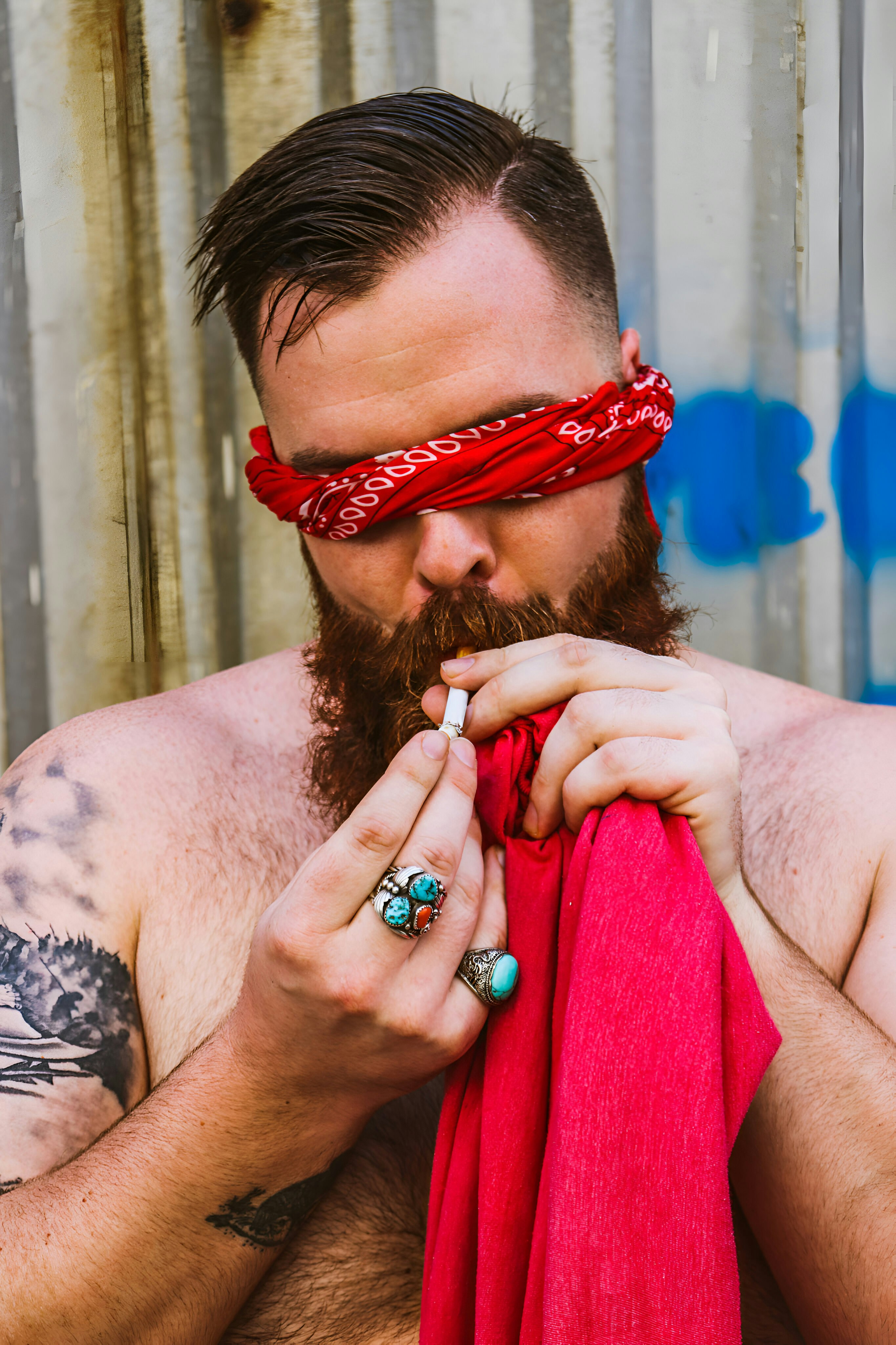 a man with a red scarf around his neck