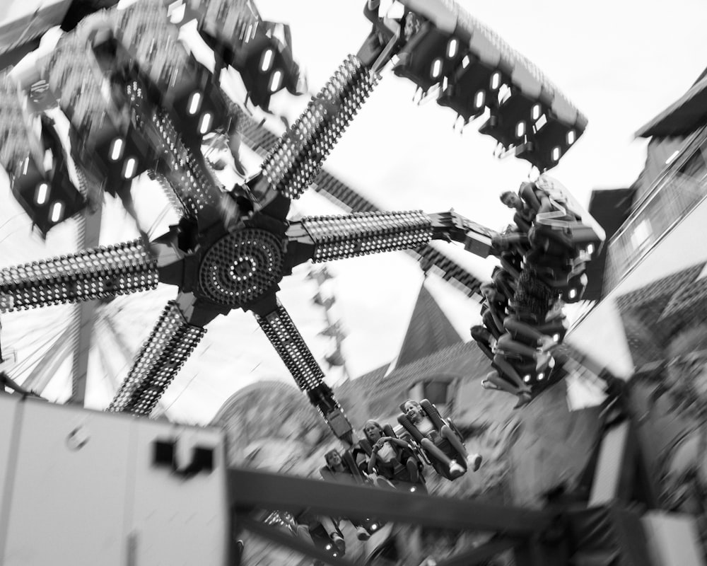 a black and white photo of a carnival ride