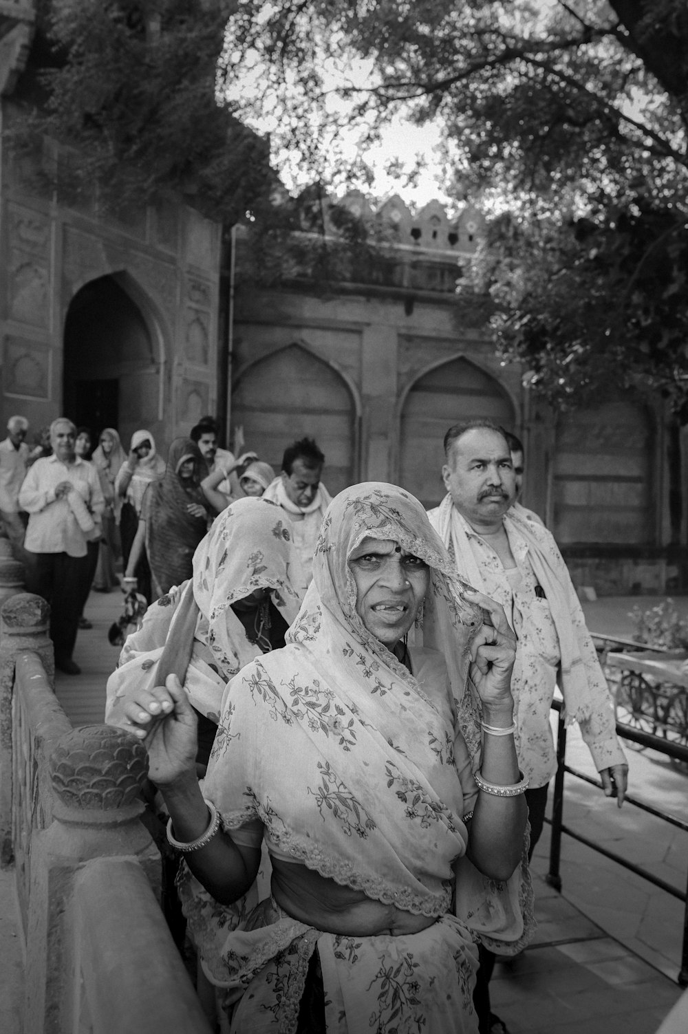 a black and white photo of a woman in a sari