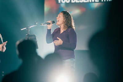 a man and a woman singing into microphones
