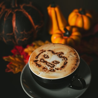 a cappuccino with a smiley face drawn on it