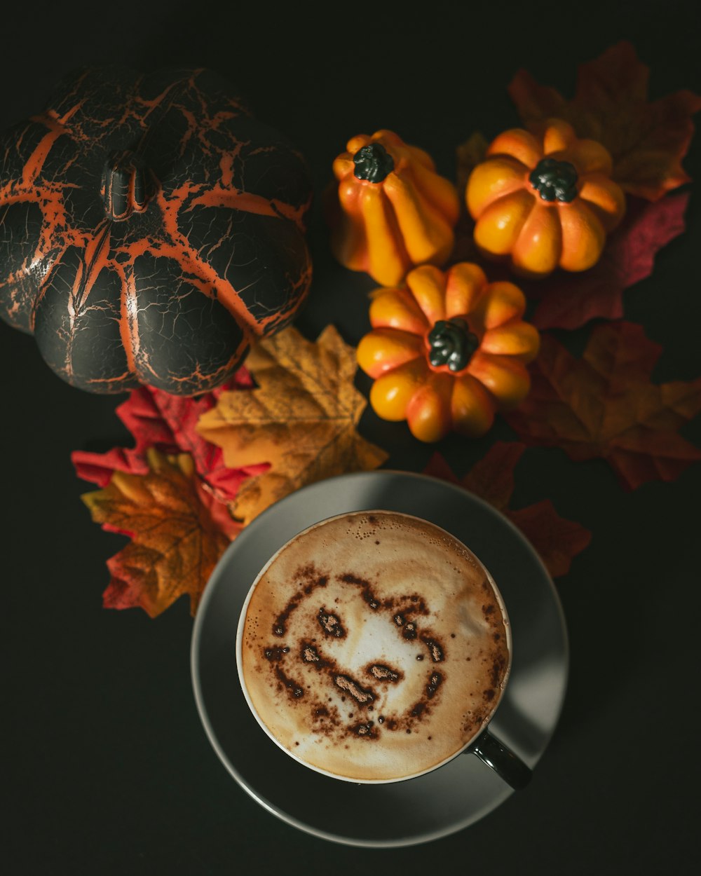 a cup of cappuccino with a swirl in the foam