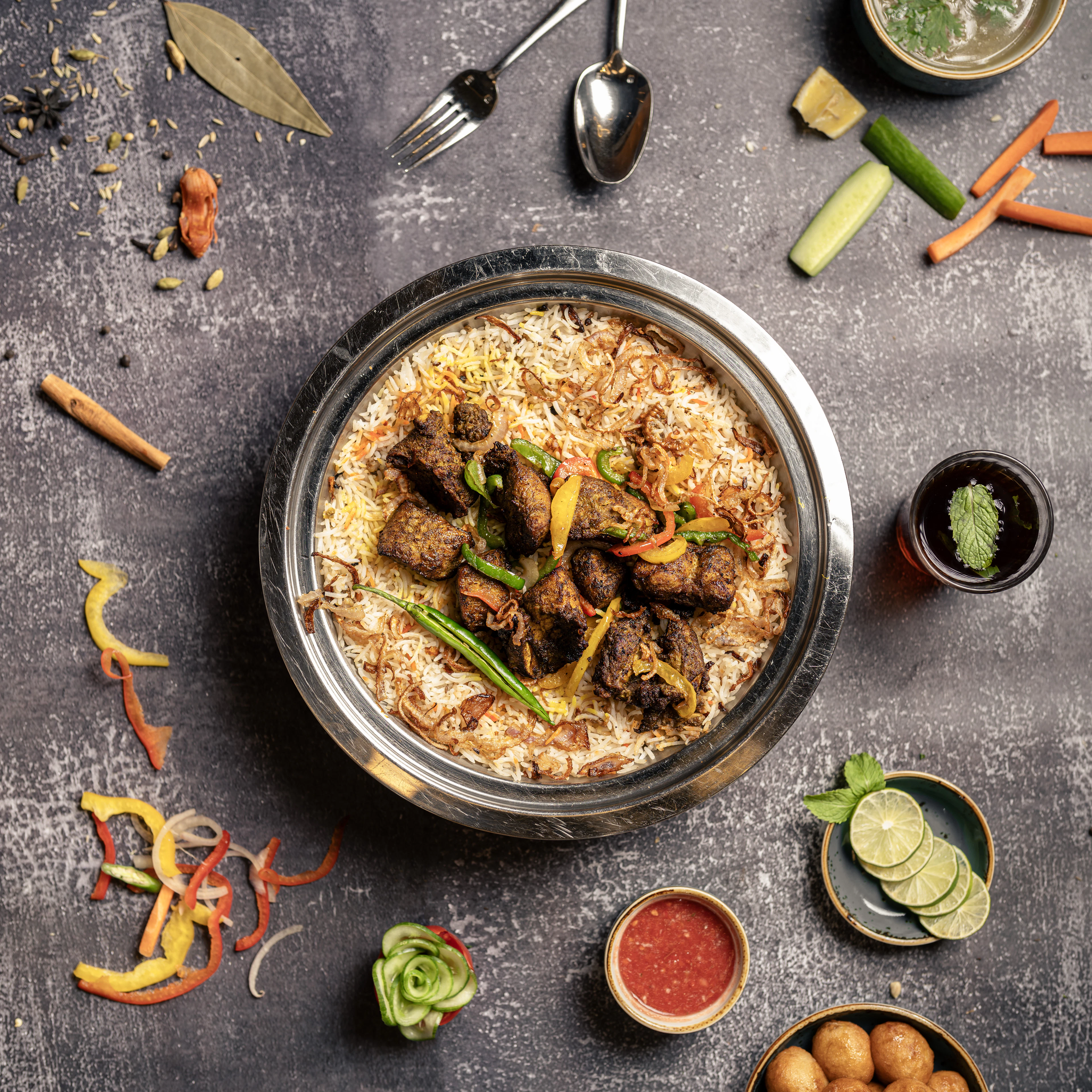 A pot of spiced rice with lamb and green chillies, AlUla