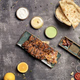 A colorful platter featuring a variety of dips and appetizers from Osi Pizza Kebab.