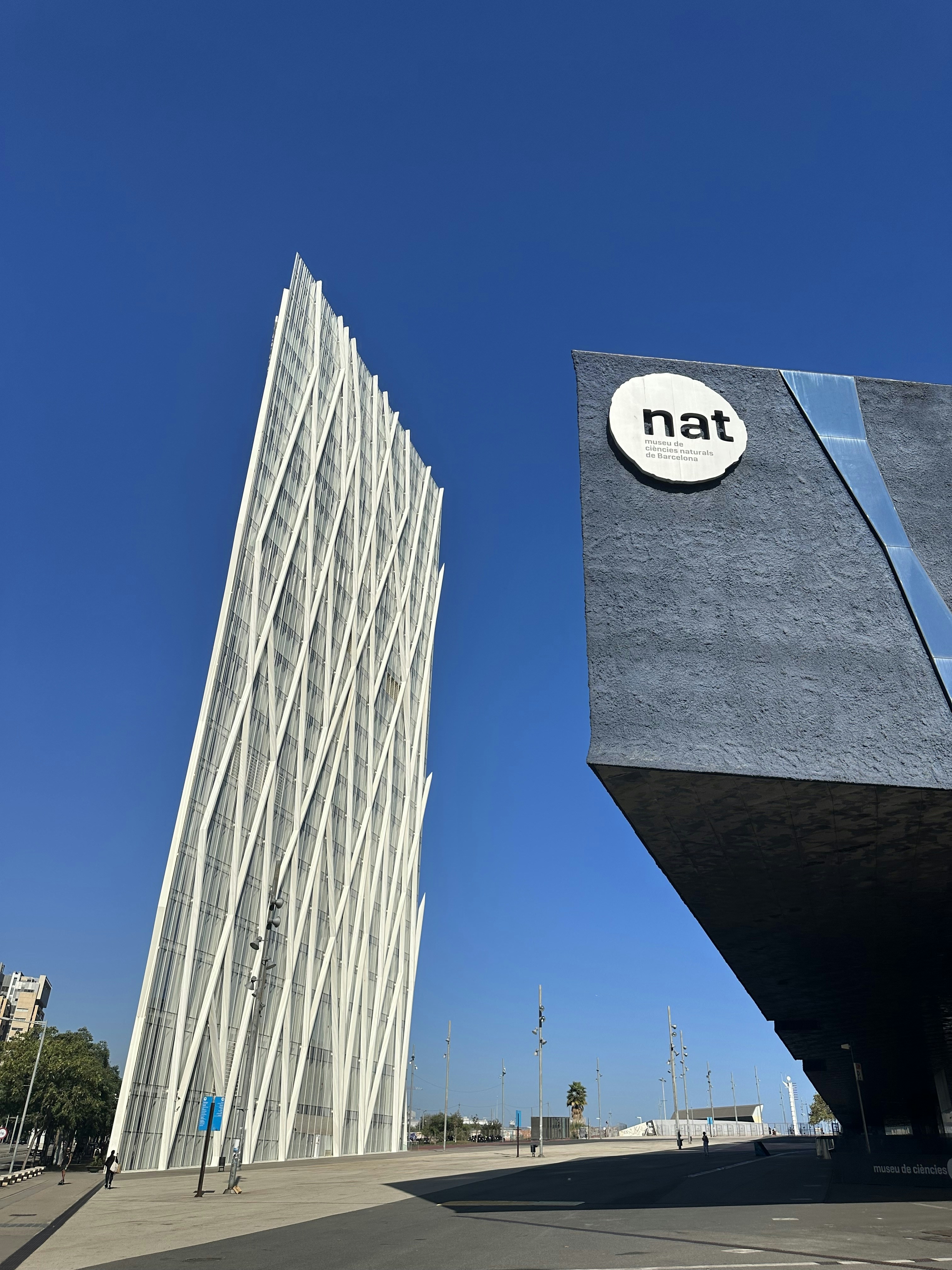 a tall building with a natt sign on it's side