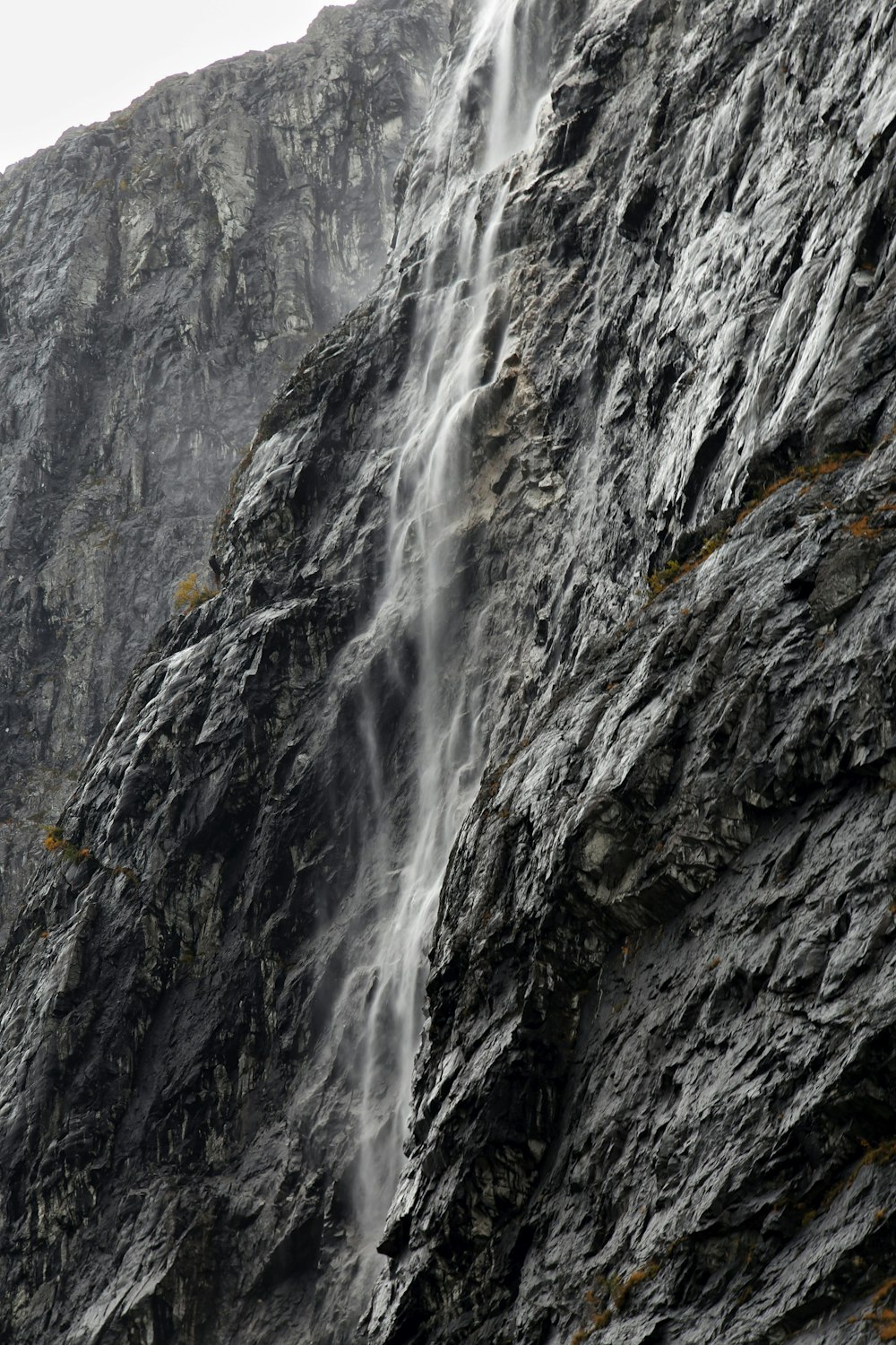 a large waterfall cascading down a mountain side