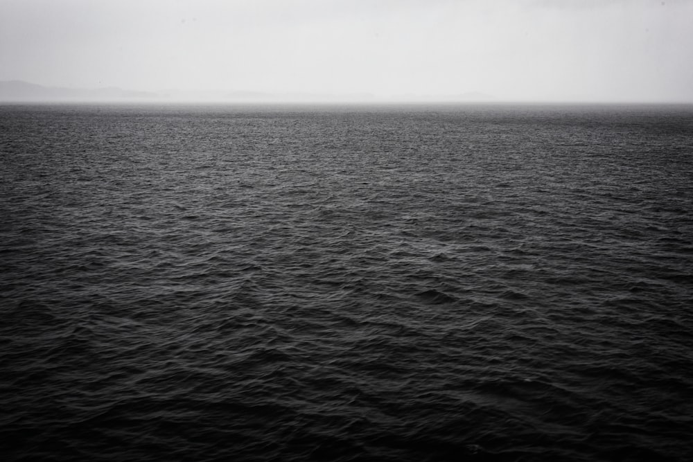 a black and white photo of a large body of water