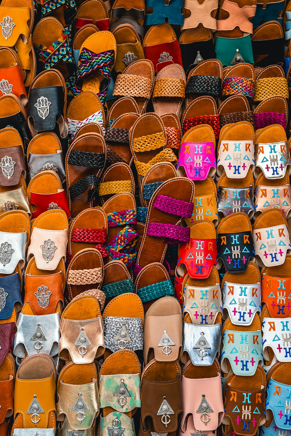 a bunch of shoes that are on display