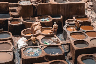 a group of clay pots filled with water