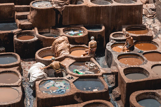 a group of clay pots filled with water