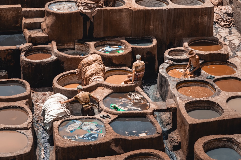 a group of clay pots filled with water