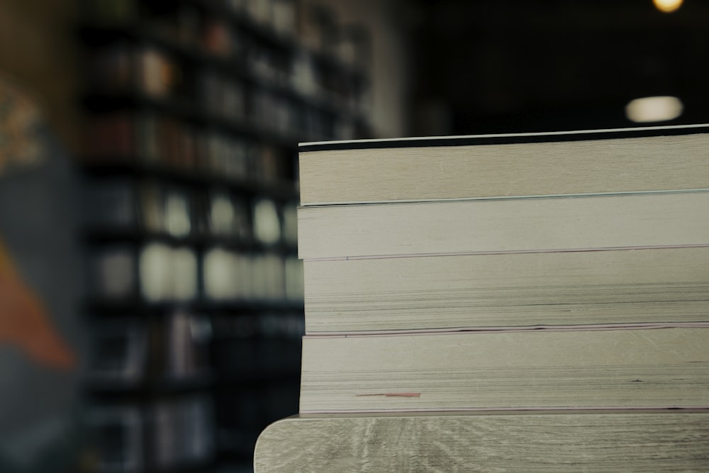 a stack of books sitting on top of a table