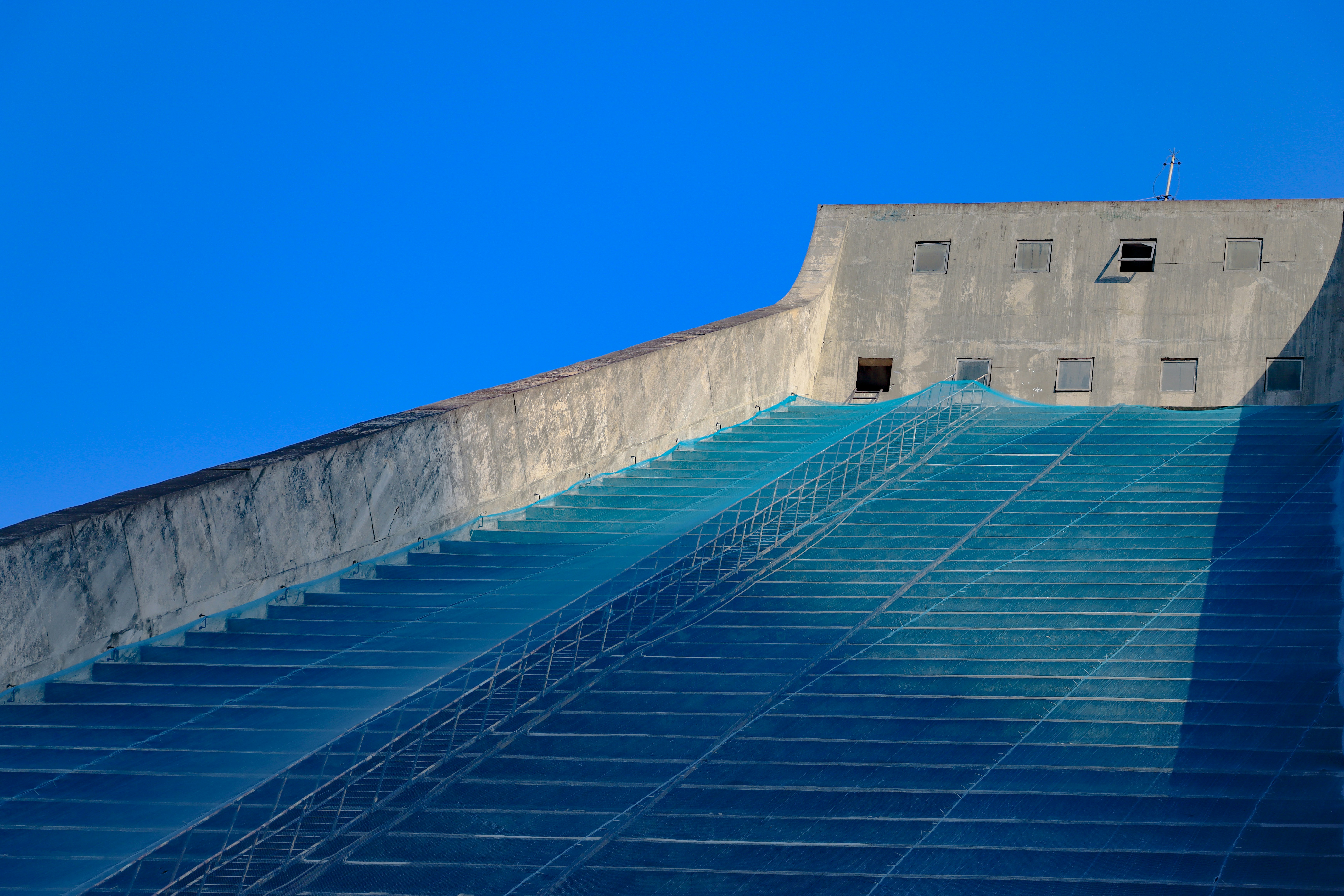 a very tall building with a very long stair case