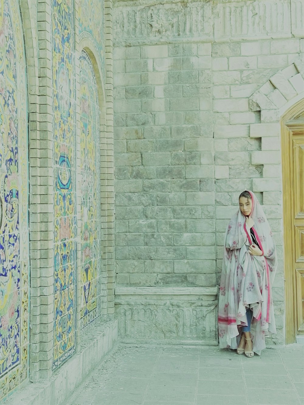 a woman standing in front of a building