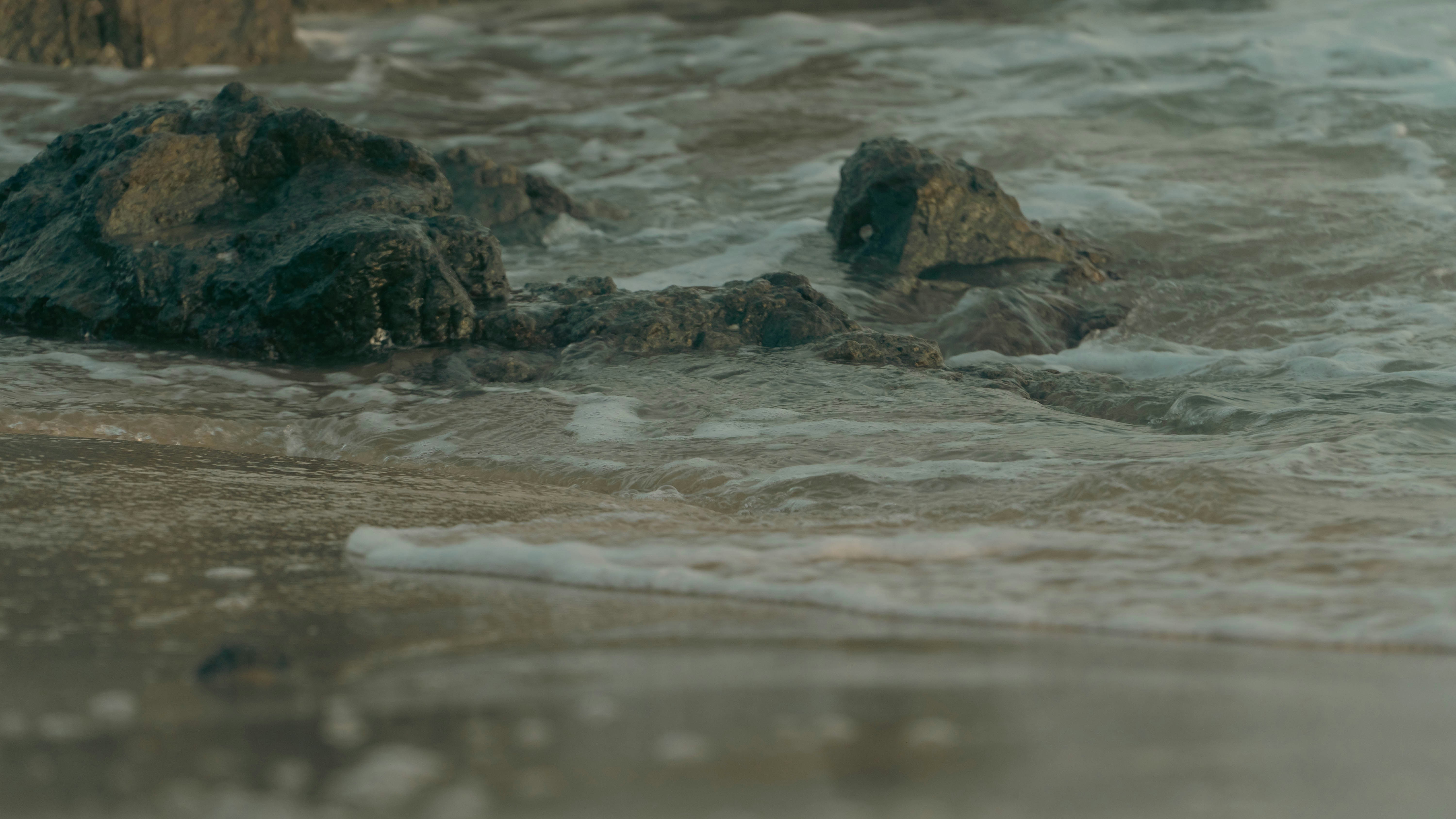 a close up of a rock in the water