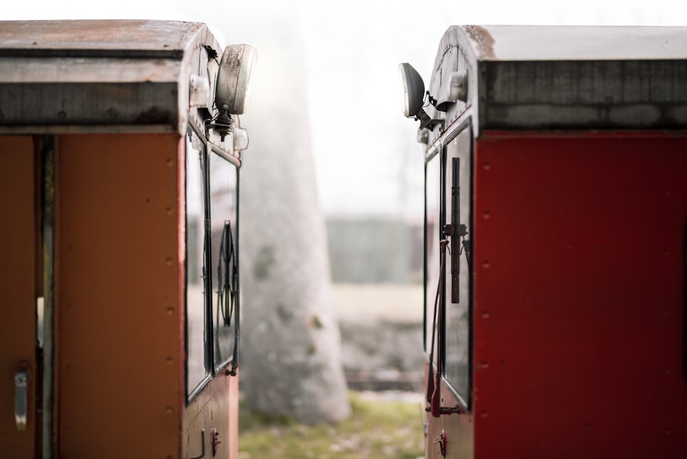 a couple of red doors sitting next to each other