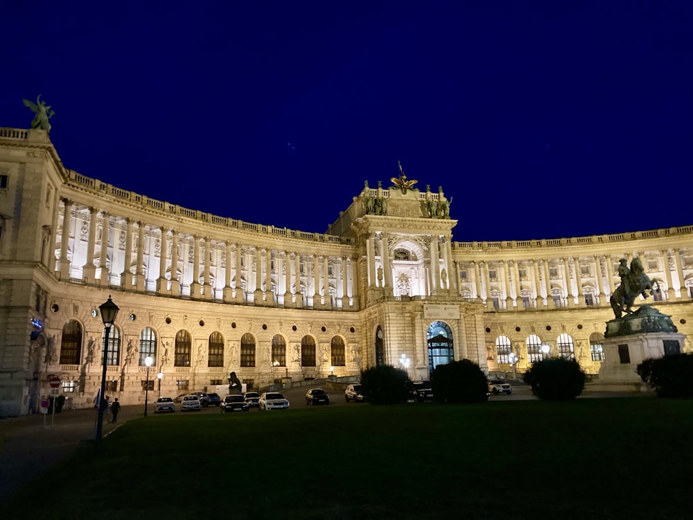 a large building with a statue in front of it