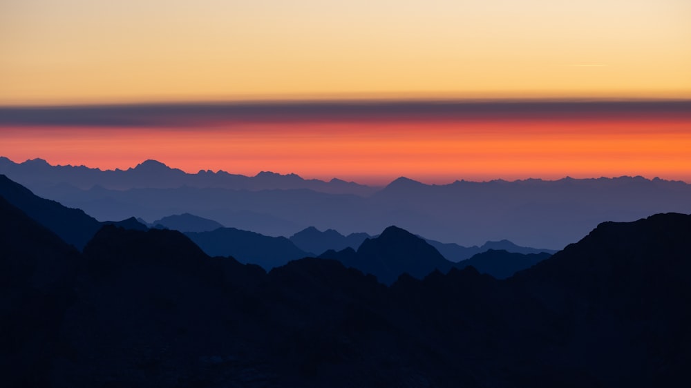 a view of a mountain range at sunset