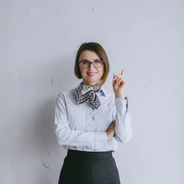 A woman proudly presenting her small business idea to a supportive group.