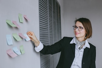Professional woman organizing sales promotion materials at a local event.