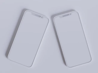 Two sleek smartphones facing each other on a futuristic digital grid background.