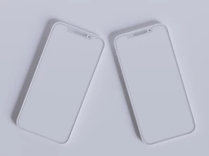 A stylish Apple iPhone and Samsung smartphone side by side on a minimalist desk.