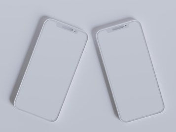 Two modern smartphones with sleek, minimalistic design are placed side by side against a light gray background. Their screens are off, reflecting the ambient light, and they feature a simple, elegant look with rounded edges and a clean interface.